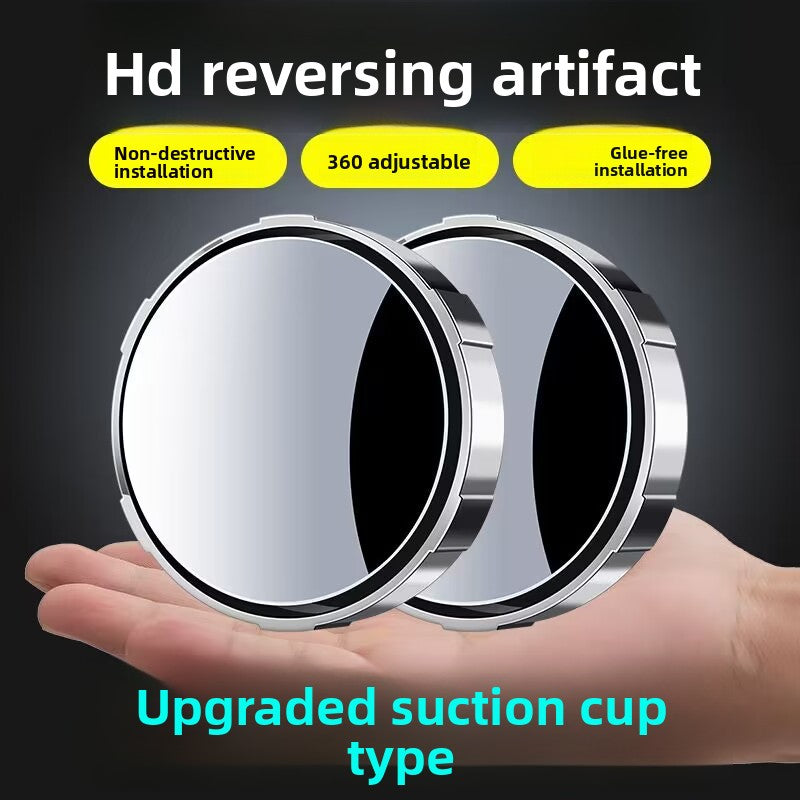 A small round car rearview mirror with a suction cup
