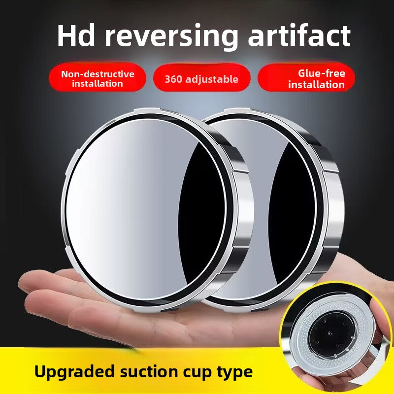 A small round car rearview mirror with a suction cup