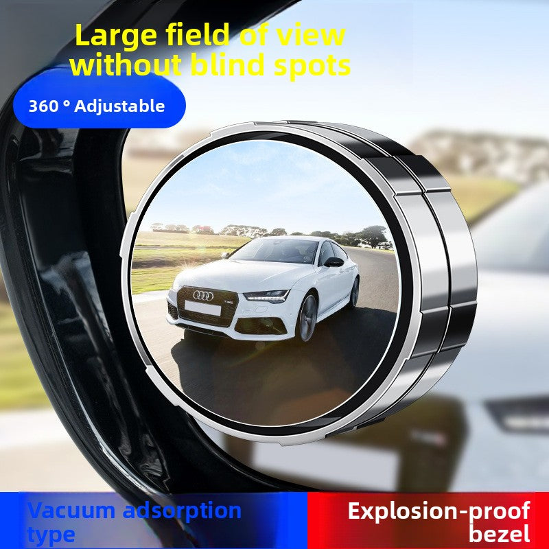 A small round car rearview mirror with a suction cup